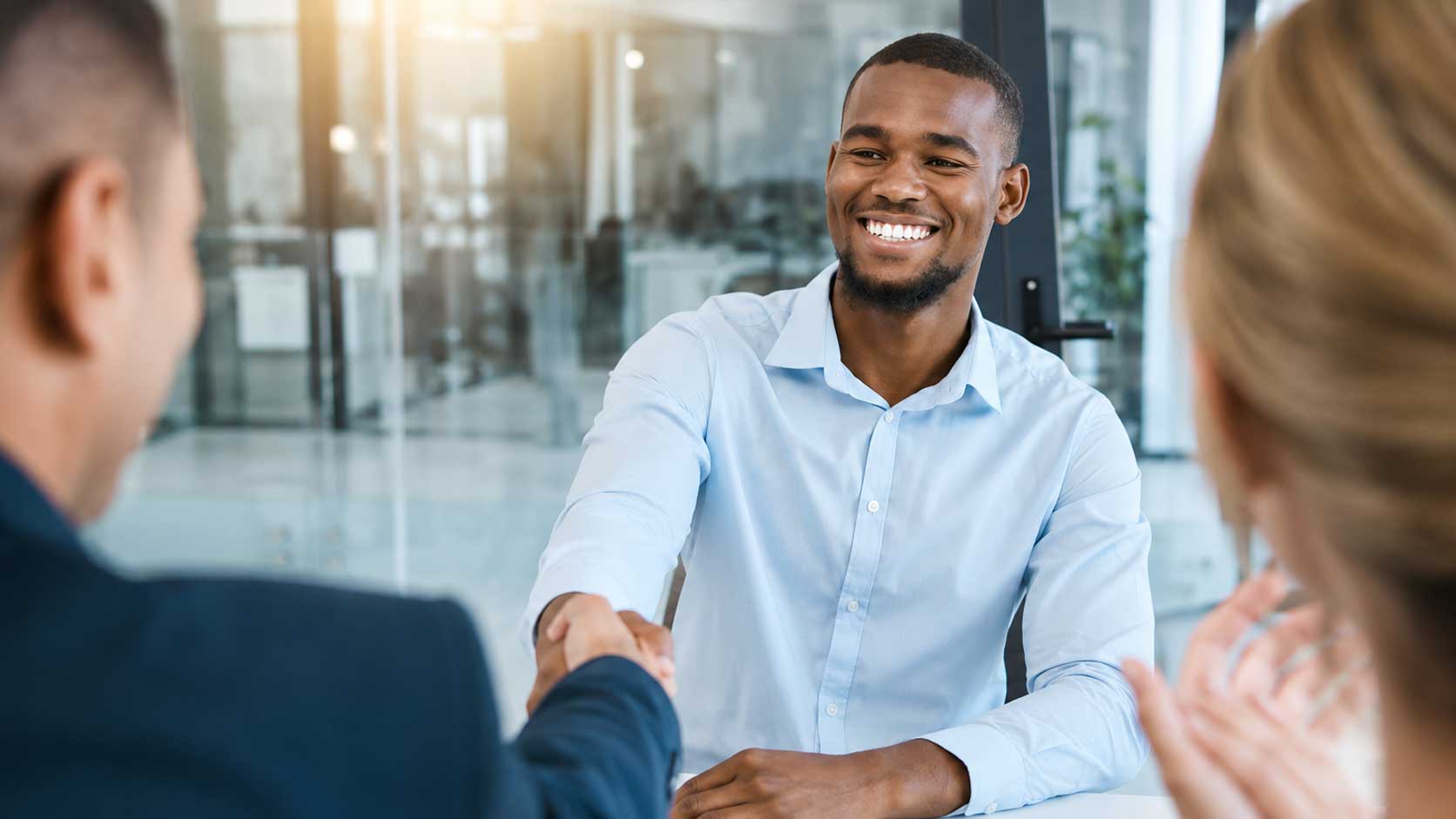 Enterprise knowledge platform consultant reviewing AI-powered search results with professional services staff